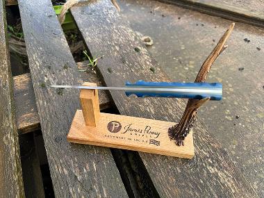 blue handled pit pony hunting knife on stand