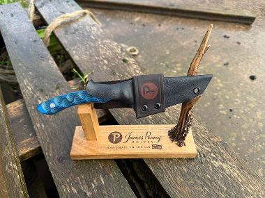 blue handled pit pony hunting knife on stand