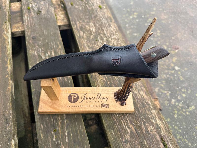 walnut handle knife in sheath